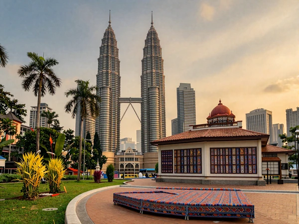 Beautiful Malaysian multicultural landscape featuring Petronas Towers alongside traditional temples and mosques, representing Malaysia's harmonious cultural diversity